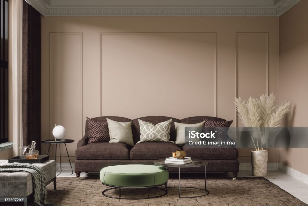 bohemian living room interior with brown furnitures and beige walls.