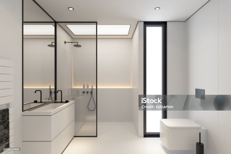 luxurious scandinavian bathroom with white stone tiles and black details.
